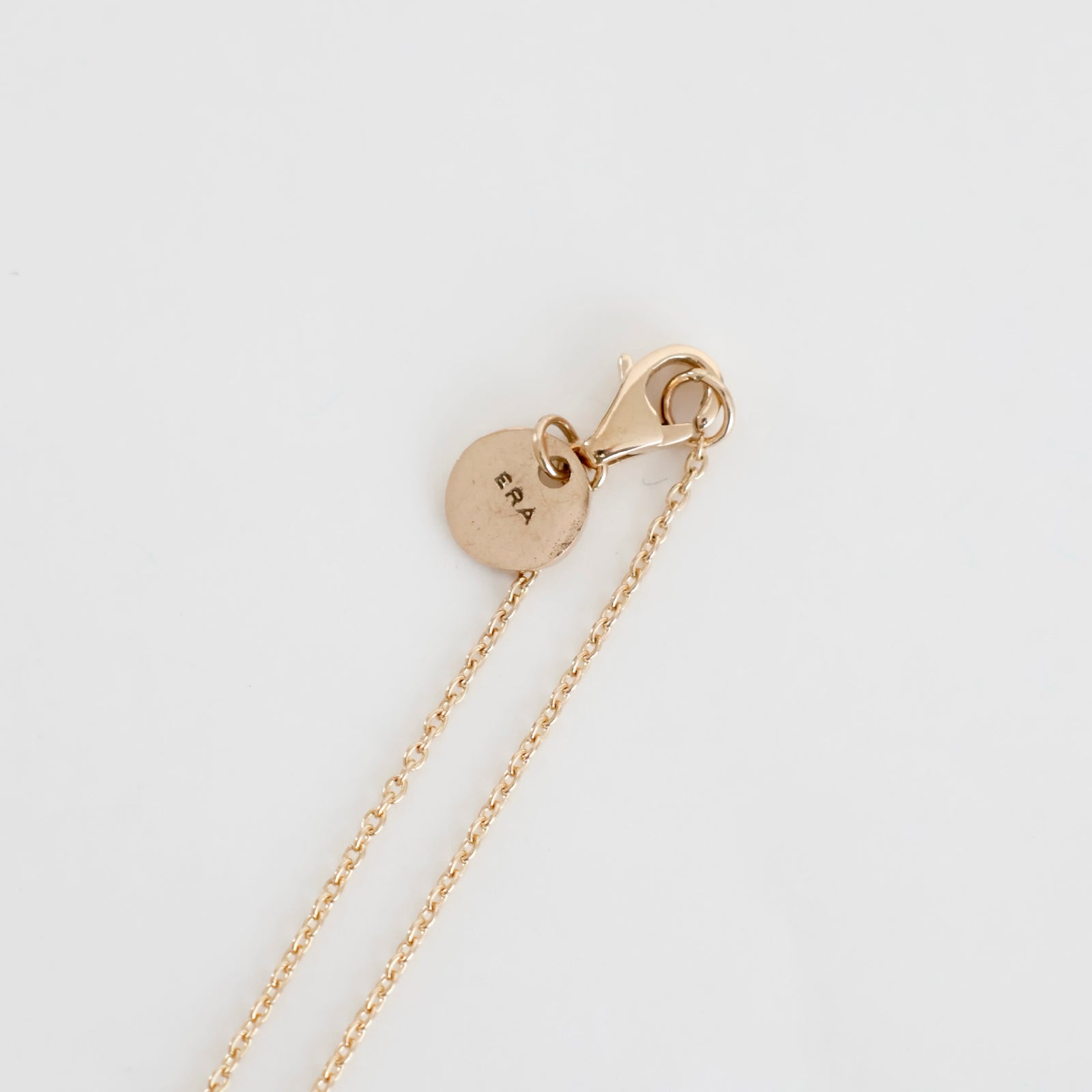 SL045 / TWNKL AZK NARROW NECKLESS 10K